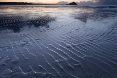 A showery morning on Long Rock beach and interesting patterns in the sand.